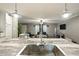 Modern stainless steel kitchen sink and faucet overlooking an expansive living space at 55 Forest Rd, Stockbridge, GA 30281