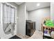Functional laundry room featuring modern washer and dryer and ample storage space at 55 Forest Rd, Stockbridge, GA 30281