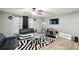 Modern living room featuring stylish furniture, television, and trendy zebra-print rug at 55 Forest Rd, Stockbridge, GA 30281