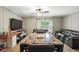 Comfortable living room area with TV, seating, and dining setup at 55 Forest Rd, Stockbridge, GA 30281
