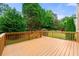 Inviting wood deck overlooks the green, tree-lined backyard at 917 Saints Ct, Marietta, GA 30068