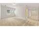 Spacious basement area featuring carpeted floors, a window and a door to the backyard at 917 Saints Ct, Marietta, GA 30068