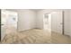 Bright bedroom with neutral carpet and view into adjoining spaces through two doorways at 917 Saints Ct, Marietta, GA 30068