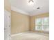 Neutral-toned bedroom with window and plush carpeting, providing a relaxing atmosphere at 917 Saints Ct, Marietta, GA 30068
