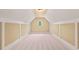 Spacious bonus room with neutral carpet, fresh paint, and vaulted ceilings at 917 Saints Ct, Marietta, GA 30068