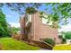 Side view of brick home with rear deck and well maintained lawn at 917 Saints Ct, Marietta, GA 30068