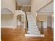 Elegant foyer with hardwood floors, a staircase with decorative iron railings, and natural light at 917 Saints Ct, Marietta, GA 30068