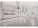 Clean, well-lit two car garage with epoxy floors and high ceilings at 917 Saints Ct, Marietta, GA 30068