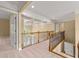 Well-lit upper hallway with wooden banister and staircase leading to lower level at 917 Saints Ct, Marietta, GA 30068