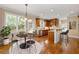 Eat-in kitchen features stainless appliances, bar seating, and sunny windows overlooking the backyard at 917 Saints Ct, Marietta, GA 30068