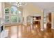 Open concept living area featuring fireplace, hardwood floors, and adjoined to the kitchen at 917 Saints Ct, Marietta, GA 30068