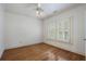 Spacious bedroom featuring hardwood floors, shutters and a ceiling fan at 1066 High Point Dr, Atlanta, GA 30306