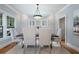 Bright dining room with large windows, wood floors, and seating for six at 1066 High Point Dr, Atlanta, GA 30306