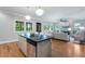 Bright and airy kitchen with a large island, hardwood floors, and stainless steel appliances at 1066 High Point Dr, Atlanta, GA 30306