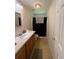 Functional bathroom with light wood cabinets and a shower-tub combination at 3398 Highway 81, Oxford, GA 30054