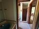 Bathroom featuring a walk-in shower with tile and a vanity with sink at 3398 Highway 81, Oxford, GA 30054