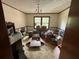A bright bedroom with large windows and space, in need of decluttering at 3398 Highway 81, Oxford, GA 30054