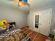Cozy bedroom with a bed, closet and bright ceiling fan at 3398 Highway 81, Oxford, GA 30054