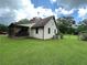 Well-maintained home with updated siding, a garden, and a convenient back porch area at 3398 Highway 81, Oxford, GA 30054