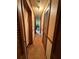 A well-lit hallway showcasing paneled doors and an entryway into other rooms at 3398 Highway 81, Oxford, GA 30054