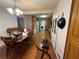 An open-concept kitchen with hardwood floors, wooden cabinets, and ample dining space at 3398 Highway 81, Oxford, GA 30054