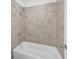 Tiled bathtub and shower area at 5325 Trescott Path, Cumming, GA 30028