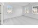 A bedroom featuring carpet, a large window and an all-white color scheme at 5325 Trescott Path, Cumming, GA 30028
