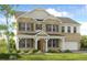 Charming brick home with covered front porch and well-maintained landscaping at 5325 Trescott Path, Cumming, GA 30028