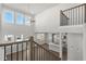View from the second story overlooking the foyer and the kitchen, offering a sense of the home's open layout at 5325 Trescott Path, Cumming, GA 30028