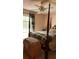 Bedroom with four-poster bed, ceiling fan, and window at 5904 Clairmont Way, Powder Springs, GA 30127