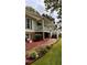 Spacious exterior with a ramp, a covered porch, and a walkway lined with flowers at 5904 Clairmont Way, Powder Springs, GA 30127