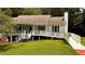 Charming single Gathering home with lush lawn, ramp access, and inviting front porch at 5904 Clairmont Way, Powder Springs, GA 30127