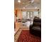 Sunny kitchen with an adjacent seating area and a view of the backyard at 5904 Clairmont Way, Powder Springs, GA 30127