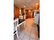 Well-lit kitchen with tile floor, wooden cabinetry, and white appliances at 5904 Clairmont Way, Powder Springs, GA 30127