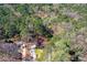 Aerial view of the home surrounded by lush green trees at 9491 Hidden Branch Dr, Jonesboro, GA 30236