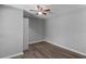 This bedroom has updated flooring and a ceiling fan at 9491 Hidden Branch Dr, Jonesboro, GA 30236