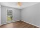 Cozy bedroom featuring new floors, a ceiling fan and plenty of natural light at 9491 Hidden Branch Dr, Jonesboro, GA 30236