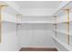 Walk-in closet with built-in shelving offers ample storage at 9491 Hidden Branch Dr, Jonesboro, GA 30236