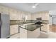 Bright kitchen with island, stainless steel appliances, and ample counter space at 9491 Hidden Branch Dr, Jonesboro, GA 30236