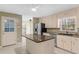 Bright kitchen with island, stainless steel appliances, and ample counter space at 9491 Hidden Branch Dr, Jonesboro, GA 30236