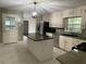 Updated kitchen with granite countertops, stainless appliances, large island and easy access to the backyard at 9491 Hidden Branch Dr, Jonesboro, GA 30236
