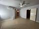 A large room with tile floors featuring multiple access points at 9491 Hidden Branch Dr, Jonesboro, GA 30236