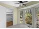 Sunny room with large windows, and a door to a walk-in closet at 9491 Hidden Branch Dr, Jonesboro, GA 30236