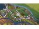 Aerial view of community featuring beautiful landscaping with walking paths, ponds, and lush greenery at 140 Rolison Way, Fayetteville, GA 30214
