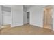 Bright bedroom with hardwood floors, closet, and an ensuite bathroom featuring natural light at 140 Rolison Way, Fayetteville, GA 30214