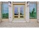 Stylish brick building entrance with large windows and stylish doors at 140 Rolison Way, Fayetteville, GA 30214