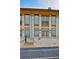 Beautiful brick building showcasing large windows, a small balcony, and exterior lighting at 140 Rolison Way, Fayetteville, GA 30214