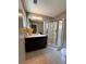 Bright bathroom featuring a glass enclosed shower, sleek vanity, and neutral color palette at 1400 Peter Haughton Nw Way, Atlanta, GA 30318