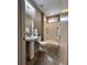View of the bathroom with a shower and pedestal sink at 1400 Peter Haughton Nw Way, Atlanta, GA 30318