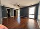 Spacious bedroom featuring hardwood floors, dark blue walls and two large windows at 1400 Peter Haughton Nw Way, Atlanta, GA 30318